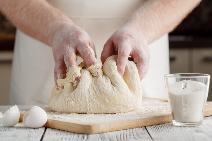 Kneeding dough with hands
